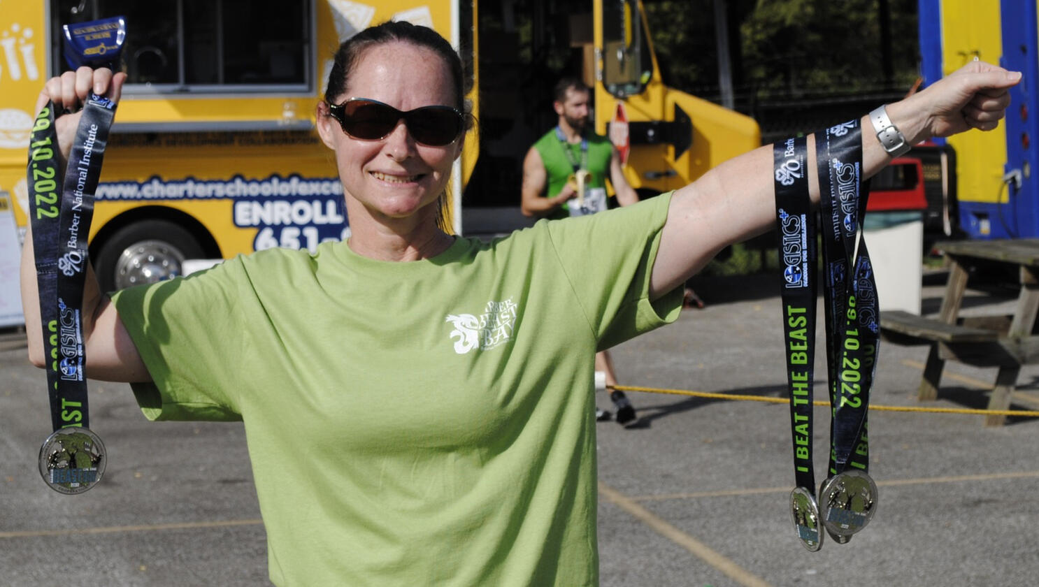 Event staff holding up medals